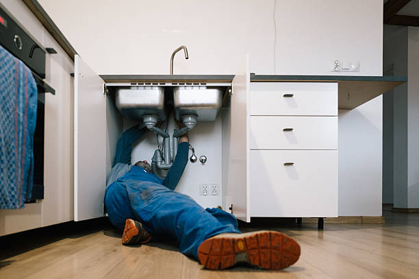 Professional Emergency Plumber technician working in Denison, TX